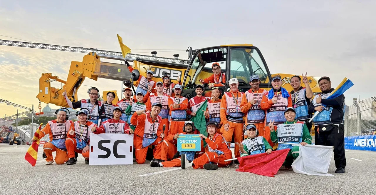 A Formula 1 team working together trackside